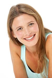 Studio Portrait Of Smiling Young Woman