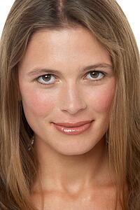Close Up Studio Portrait Of Smiling Young Woman