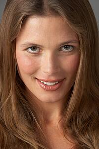 Close Up Studio Portrait Of Smiling Young Woman
