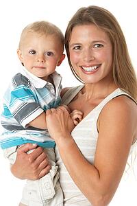 Studio Portrait Of Mother Holding Son