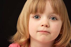 Close Up Studio Portrait Of Sad Young Girl