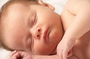 Close Up Of Baby Sleeping On Towel