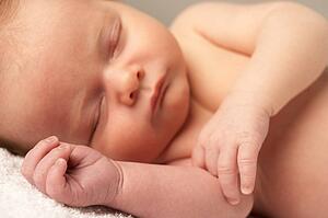 Close Up Of Baby Sleeping On Towel