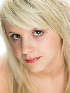 Close Studio Portrait Of Blonde Teenage Girl