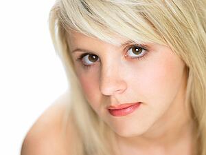 Close Studio Portrait Of Blonde Teenage Girl