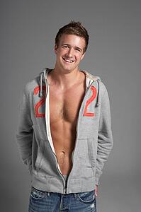 Studio Portrait Of Sexy Young Man Wearing Hooded Sweat Top