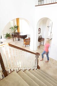 House Interior Showing Staircase And Abstract Female Figure