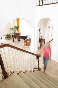 House Interior Showing Staircase And Abstract Female Figure