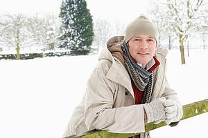 Man Standing Outside In Snowy Landscape