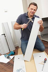 Man Assembling Flat Pack Furniture