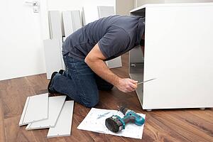 Man Assembling Flat Pack Furniture