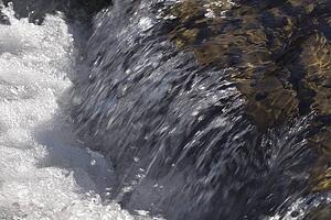 kananaskis country, alberta, canada; water cascading over rocks in elbow river