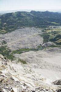 crowsnest pass, alberta, canada; looking down from the mountain peak at frank slide on turtle mountain