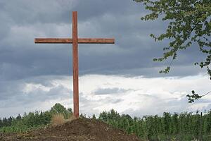 a cross on a hill