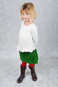 a young girl dressed for christmas