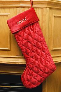 a stocking for mom hung by the fireplace