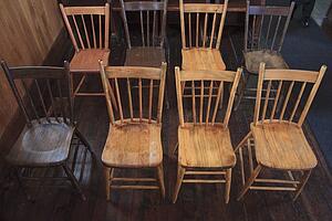 wooden chairs set up in rows