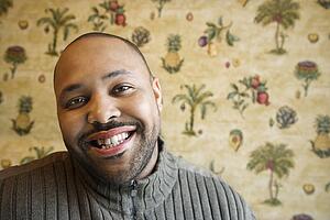 Young Man Smiling at Camera