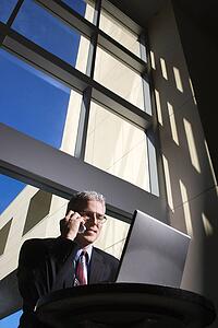 Businessman with Laptop Computer and cell phone