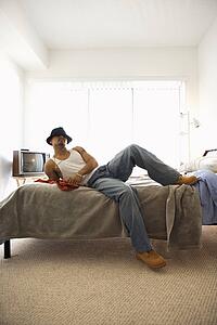 Young Man Lying on Bed
