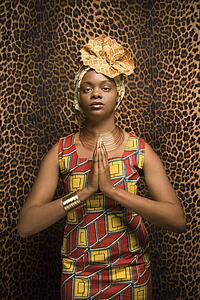 Young Woman Praying and Wearing Traditional African Dress