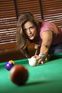 Young Woman Playing Billiards