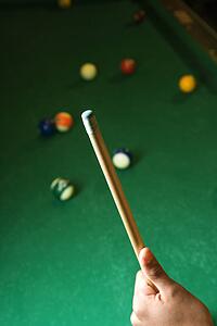 Hand Holding Pool Cue