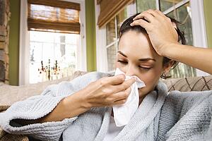 Ill Woman Blowing Nose