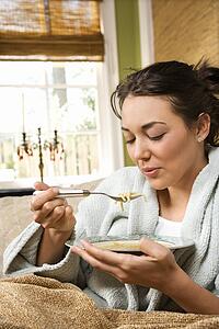 Woman Eating Soup