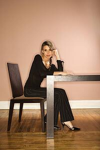 Young Businesswoman Sitting at a Table