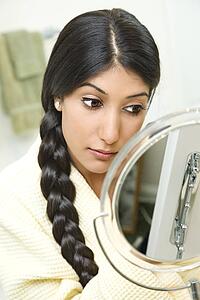Young Woman Applying Makeup
