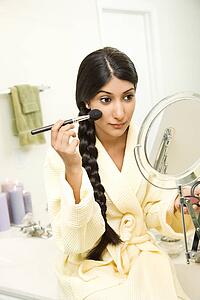Young Woman Applying Makeup