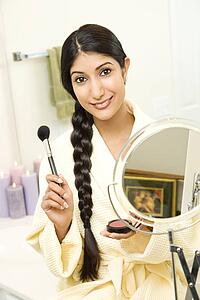 Young Woman Applying Makeup