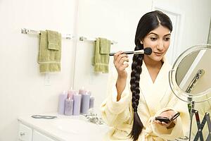 Young Woman Applying Makeup