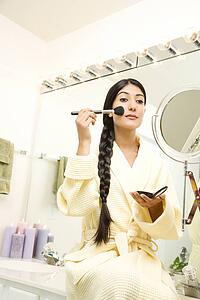 Young Woman Applying Makeup