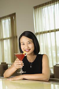 Attractive Young Woman Smiling with Beverage