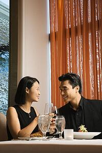 Attractive Young Couple Smiling at Each Other