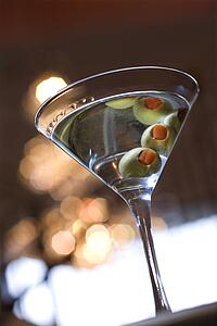 Martini With Olives Reflected in Top of Drink