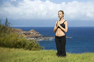 Young Woman Standing in Meditation