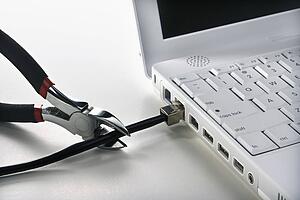 Wire Cutters Cutting Cable to Laptop