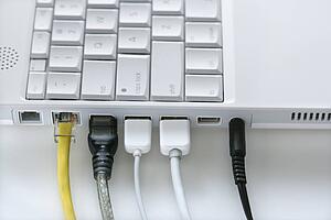 Cords Plugged Into Laptop Computer