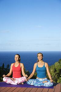 Young Women Doing Yoga
