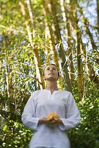 Woman Holding Flower Outdoors