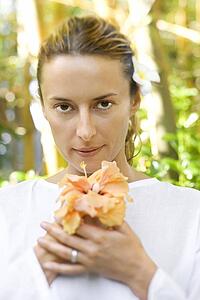 Attractive Woman Holding Flower