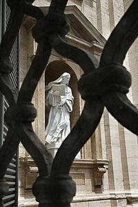 Statue of Saint Teresa of Avila Viewed Through Fence
