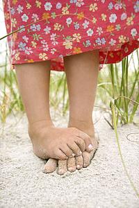 Little Girl's Feet in the Sand