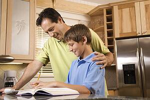 Father Helping Son with Homework