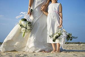 Bride and Flower Girl on Beach