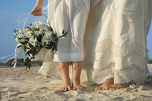 Bride and Flower Girl on Beach