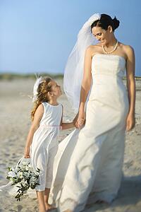 Bride and Flower Girl on Beach